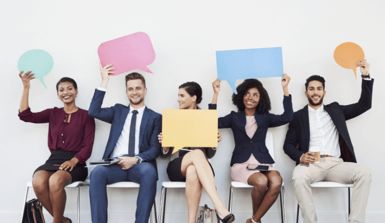 group holding speech bubble signs